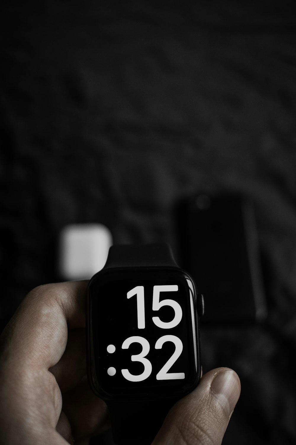 a hand holding a black and white lighter