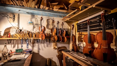 a room with many guitars on the wall