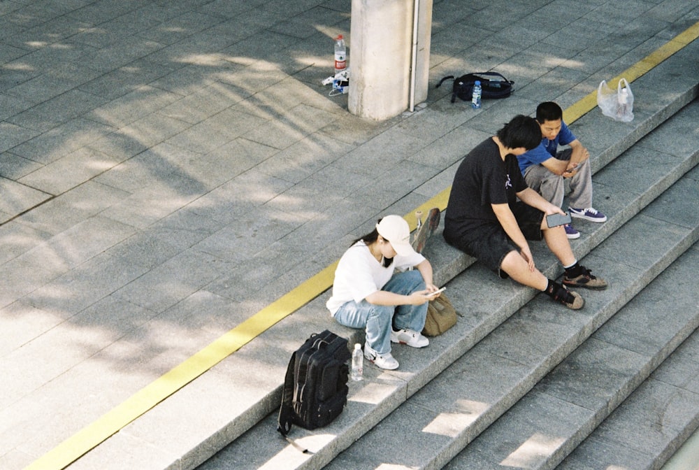 a group of people sitting on the steps