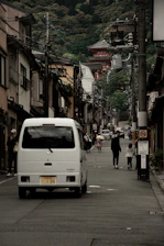 Delivery van loaded with electrical supplies driving through Mandalay streets.