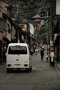Delivery van loaded with electrical supplies driving through Mandalay streets.