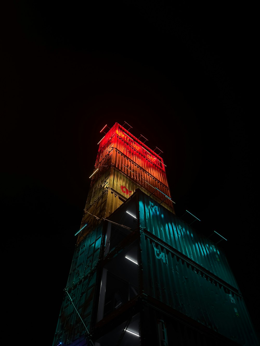 a tall building with a red and blue top