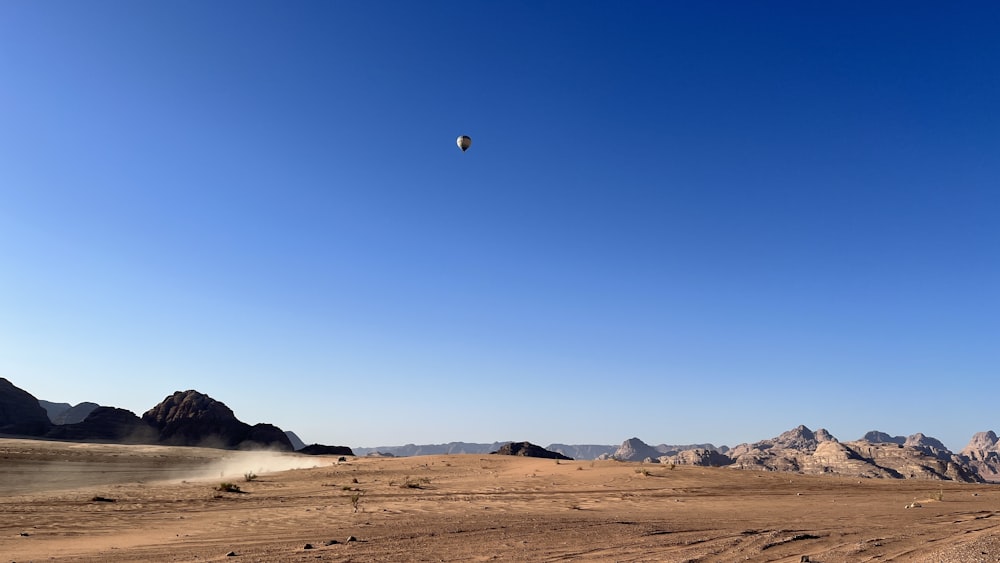 a desert landscape with a moon