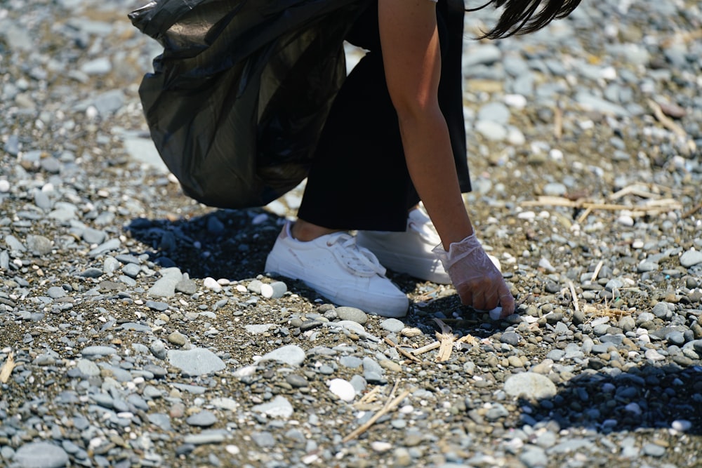 a person's legs and feet in the sand