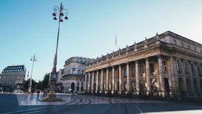 a large building with columns and a clock tower