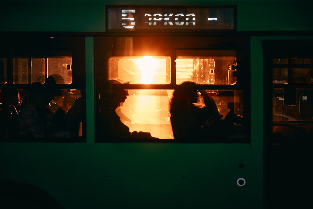 a group of people sitting in a train