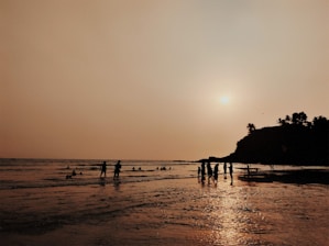 a group of people on a beach