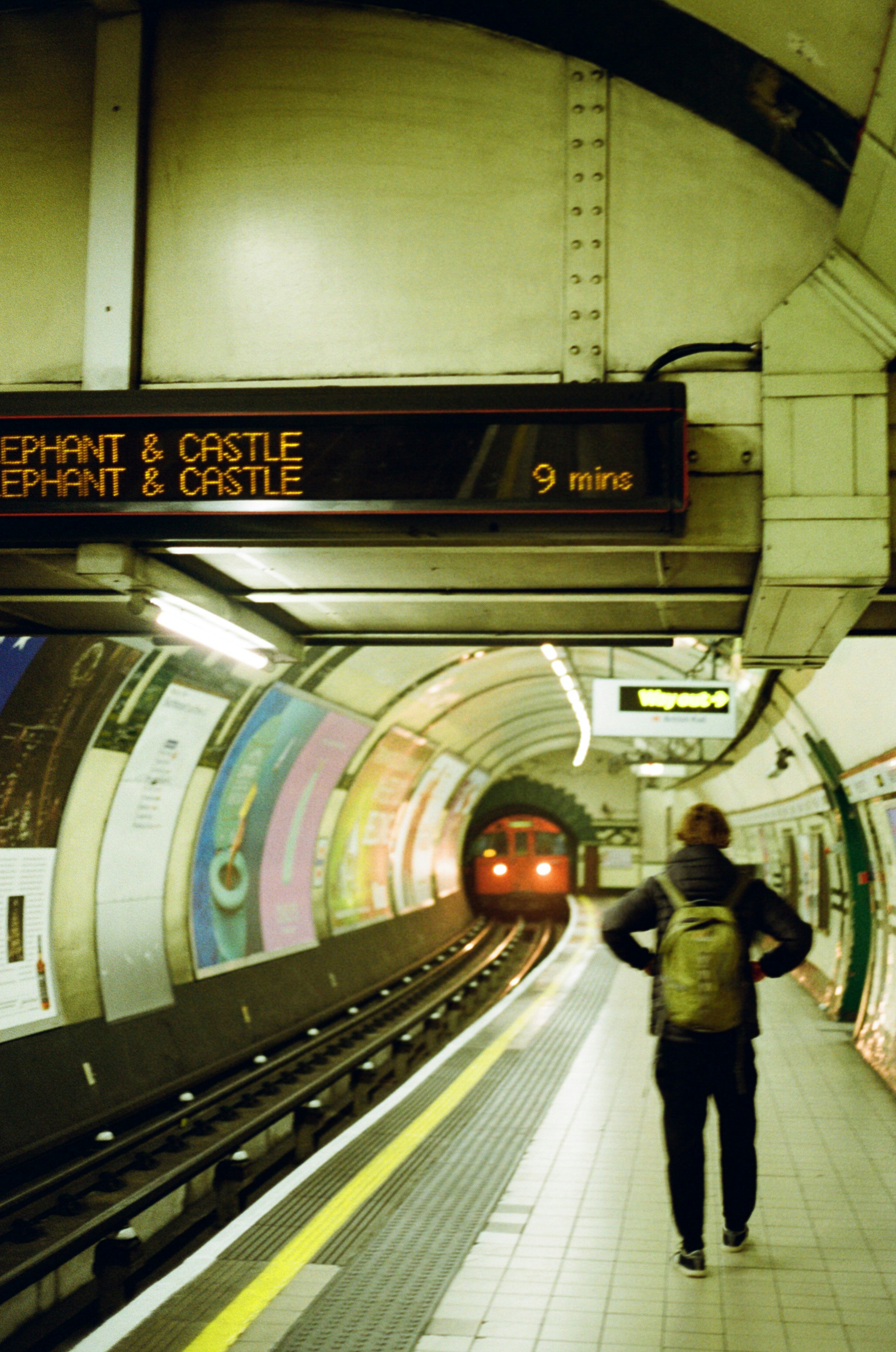 A person walking on a platform photo – Free Human Image on Unsplash
