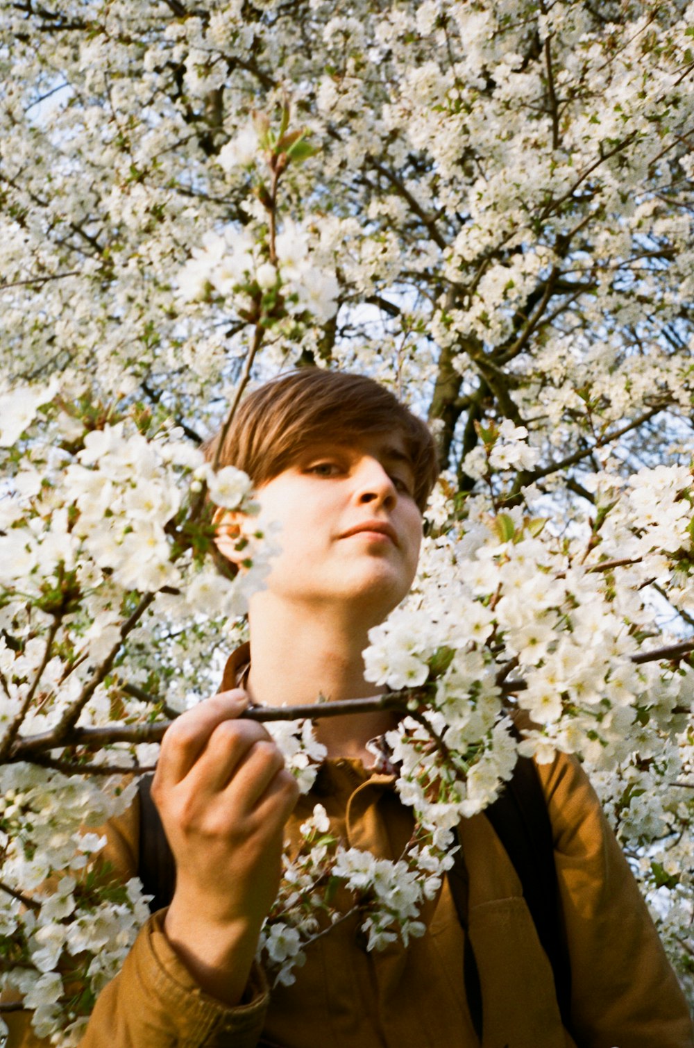 a person holding a vase with flowers