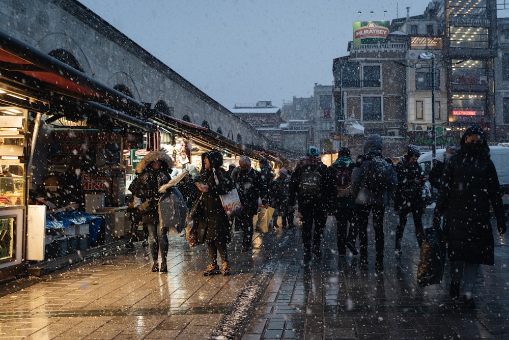 a group of people walking down a street