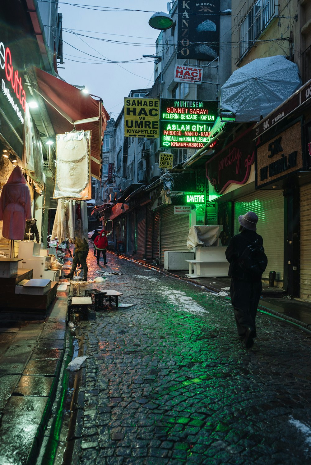 a person walking down a narrow street