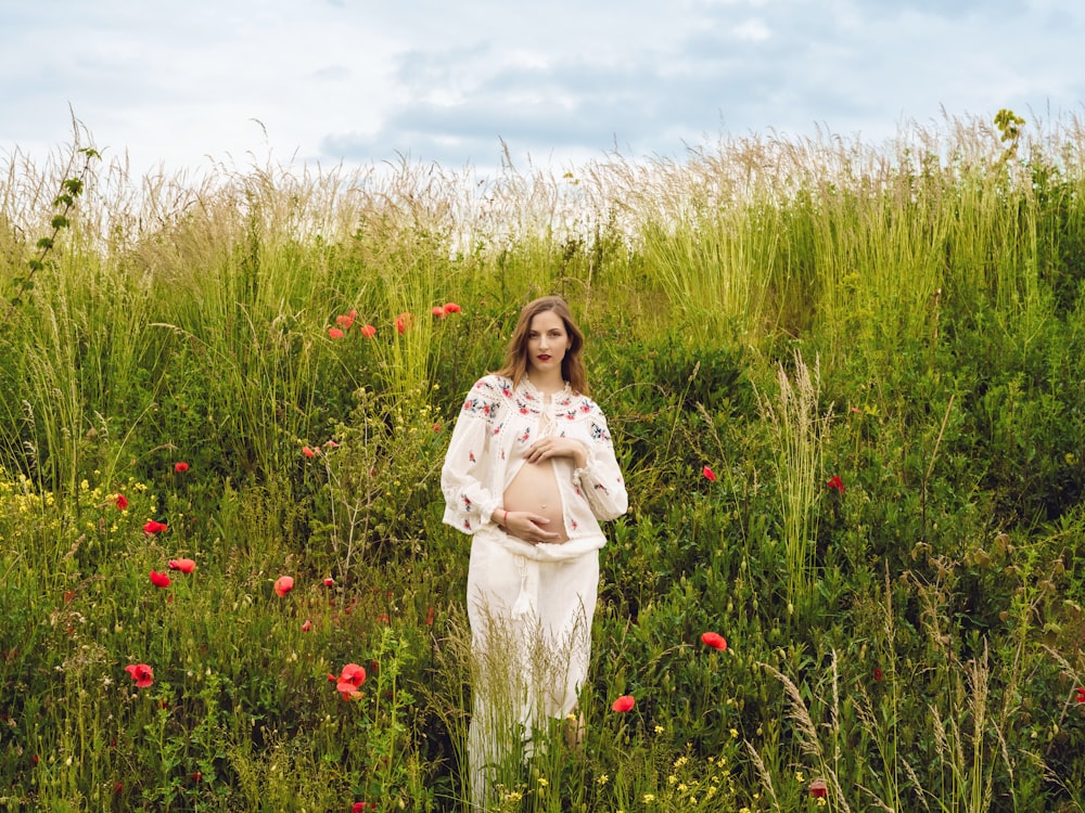 a person standing in a field of flowers