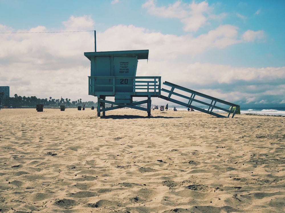 a sandy beach next to the ocean