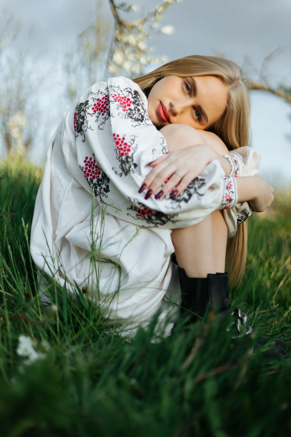 a person sitting in a field of grass