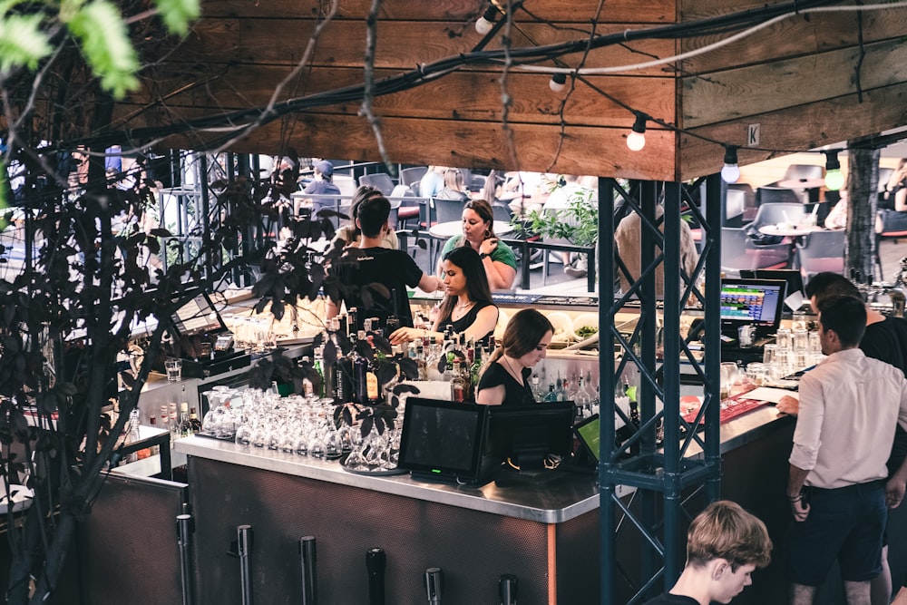 a group of people at a food stand