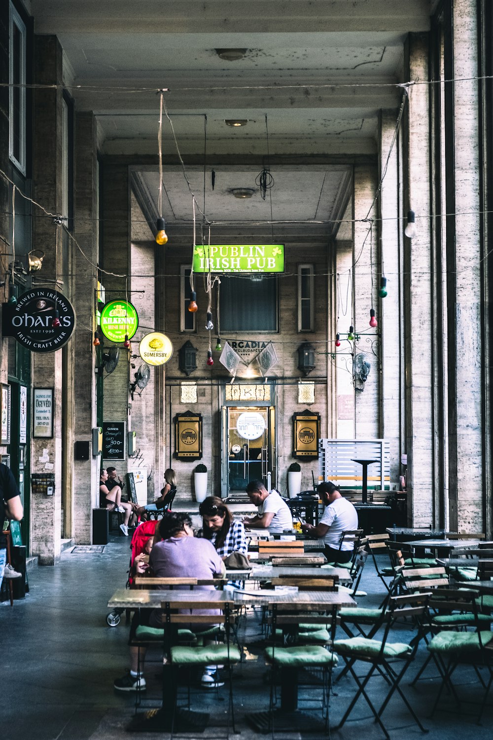 people sitting at tables in a restaurant