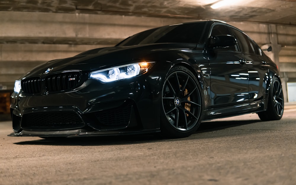 a black car parked in a garage