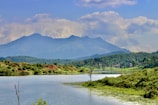 A serene landscape with a calm lake and mountains.