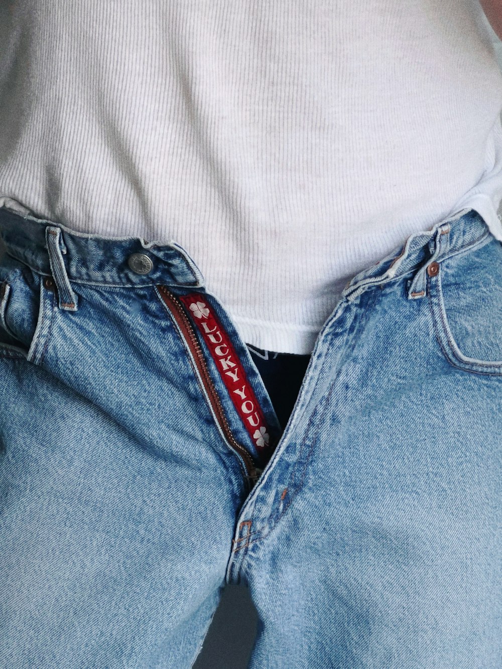 a person's jeans with a red label on it