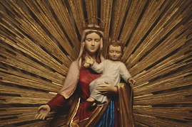 a woman holding a baby