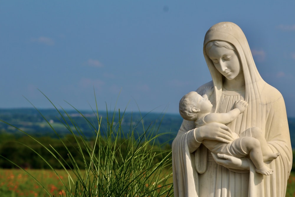 a statue of a person and a baby