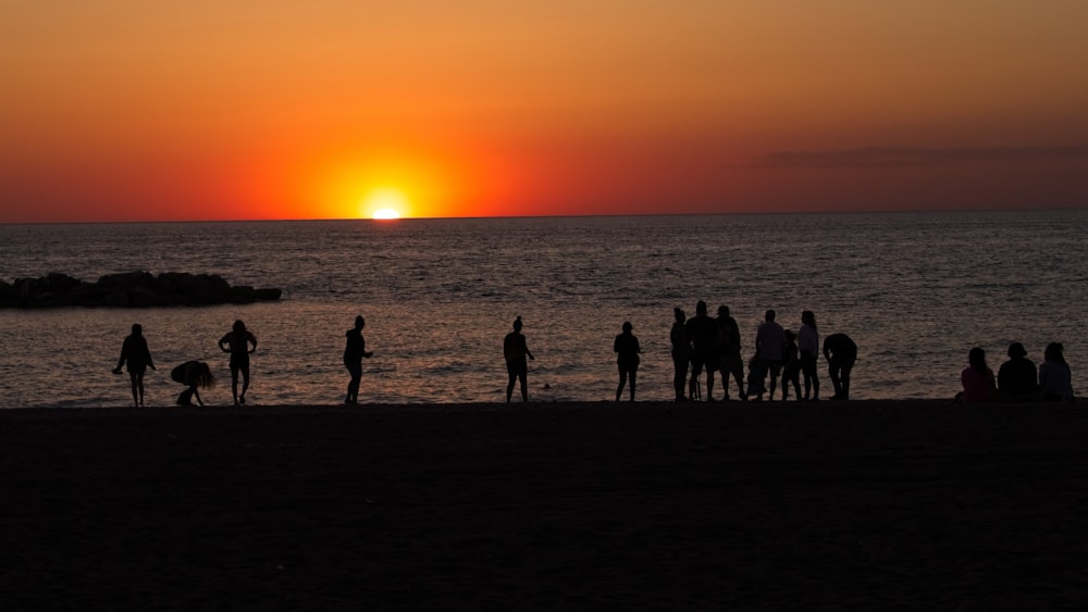 a group of people on a beach