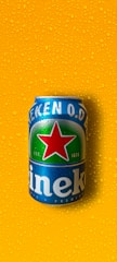 A group of people celebrating with Heineken products.