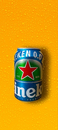 A group of people celebrating with Heineken products.