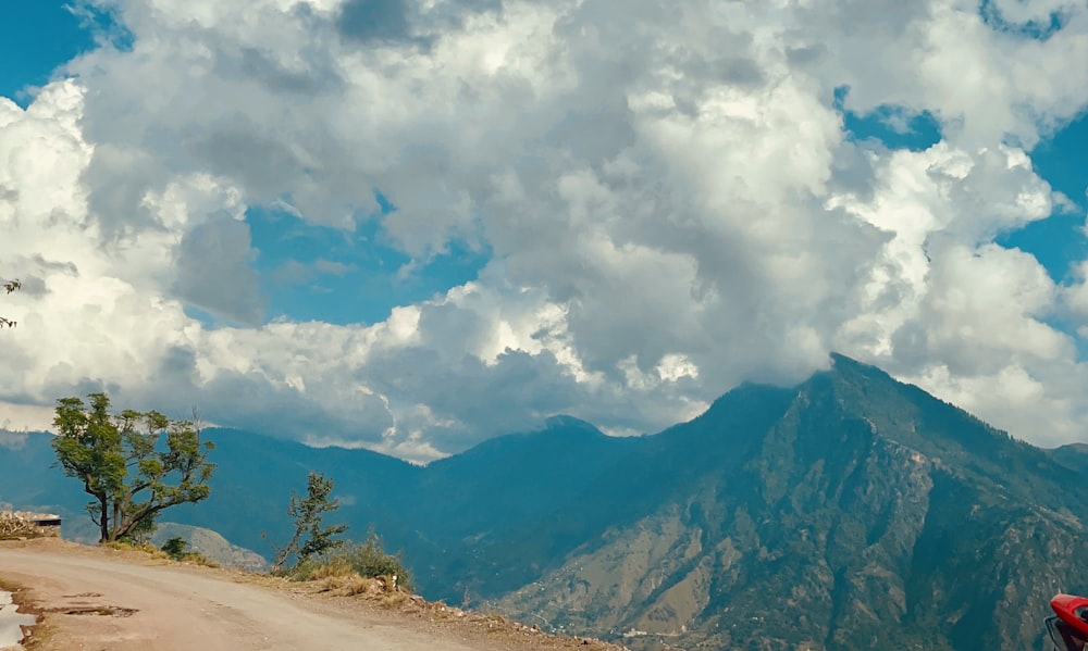 a landscape with mountains and clouds