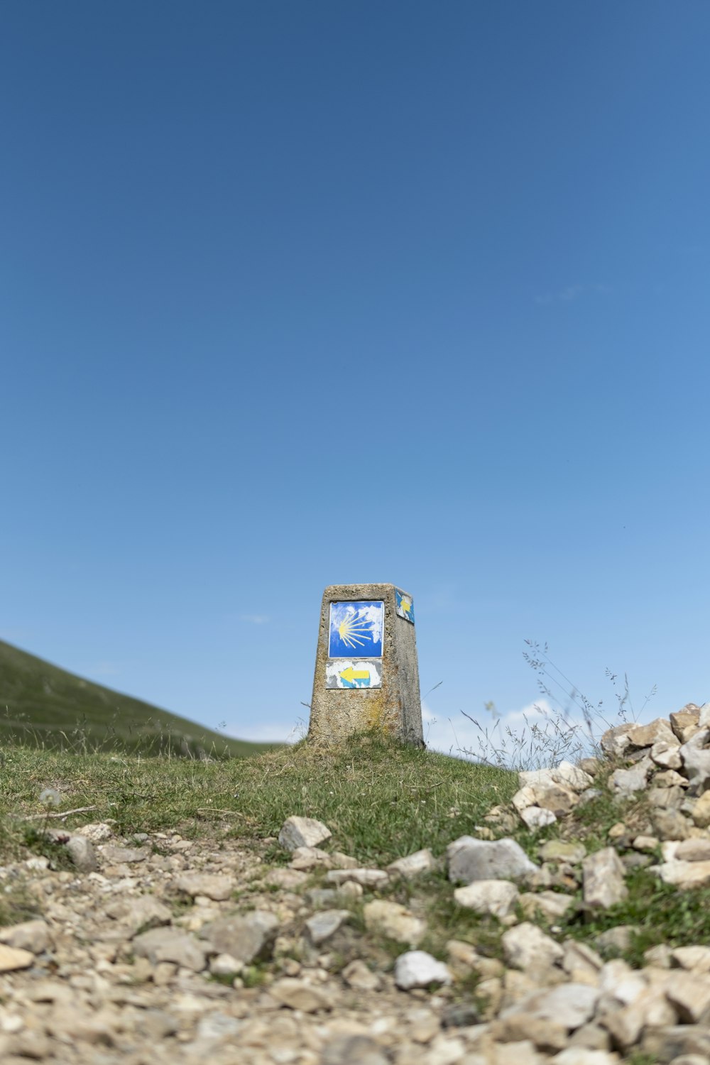 a sign on a hill