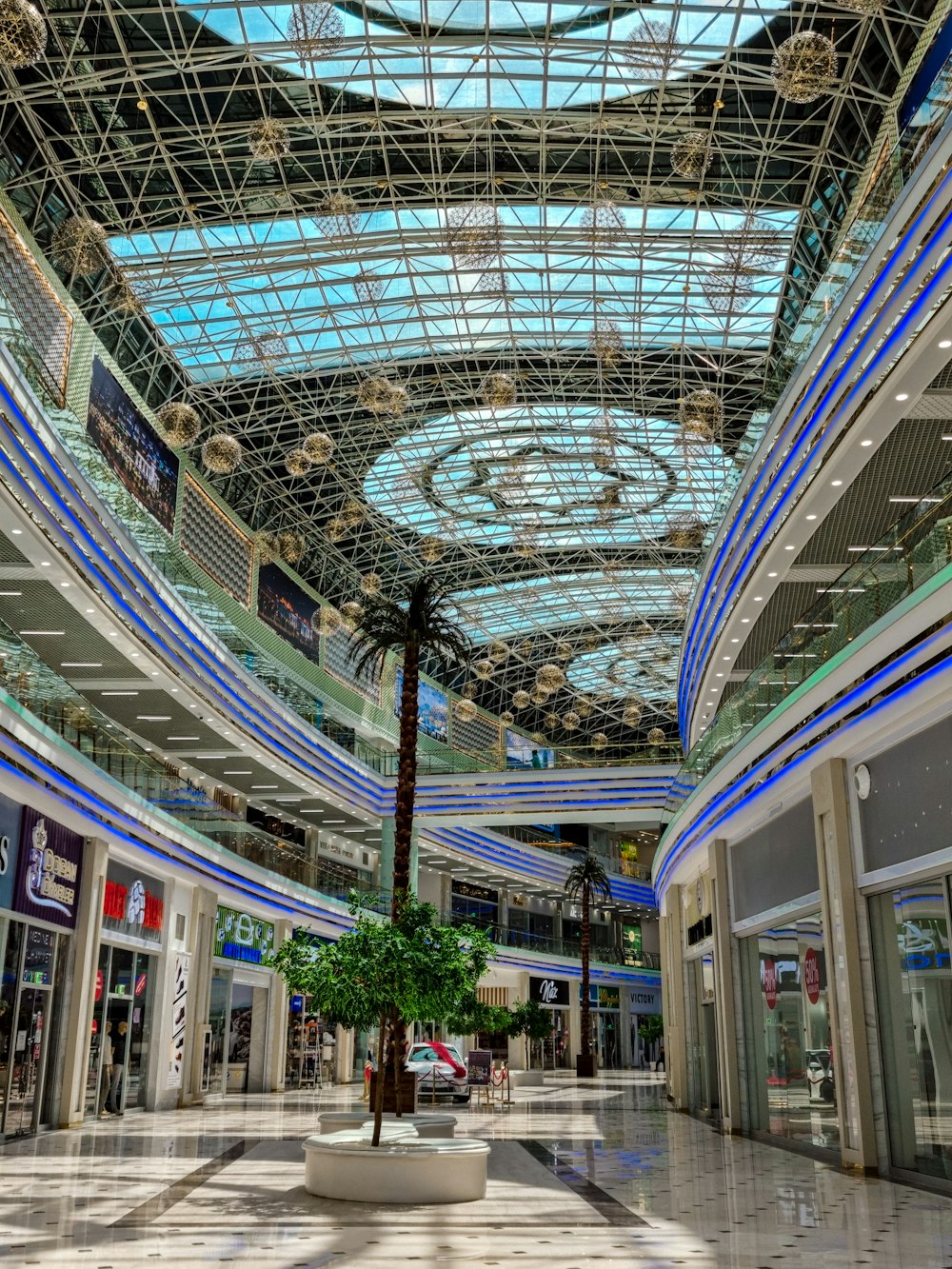 a large indoor mall with a large glass ceiling