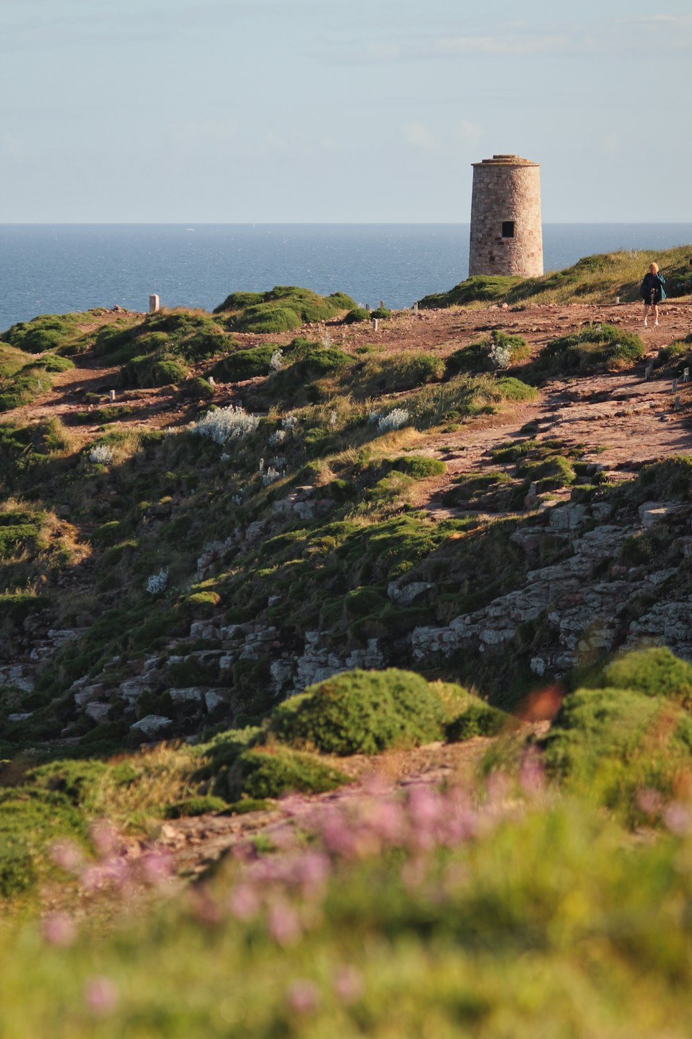 a stone tower on a hill