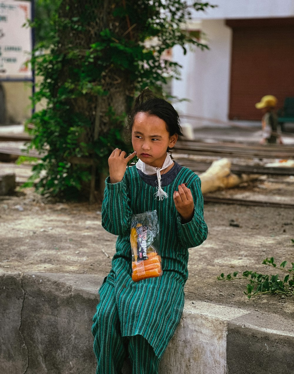 a young girl holding a book