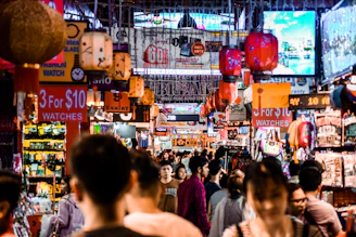 a crowded street with many signs