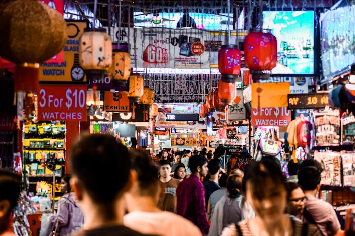 a crowded street with many signs