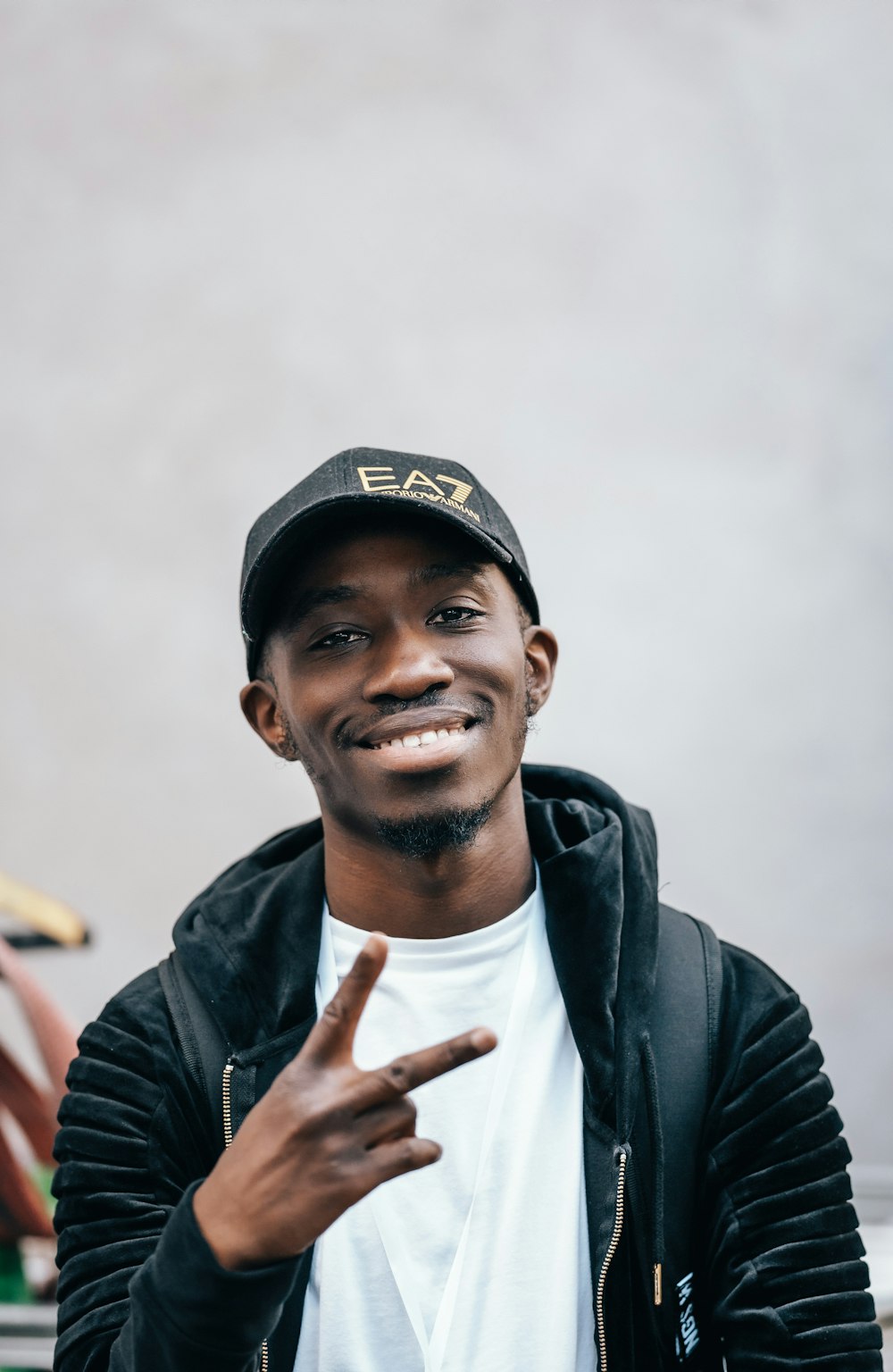 a man smiling with his thumbs up