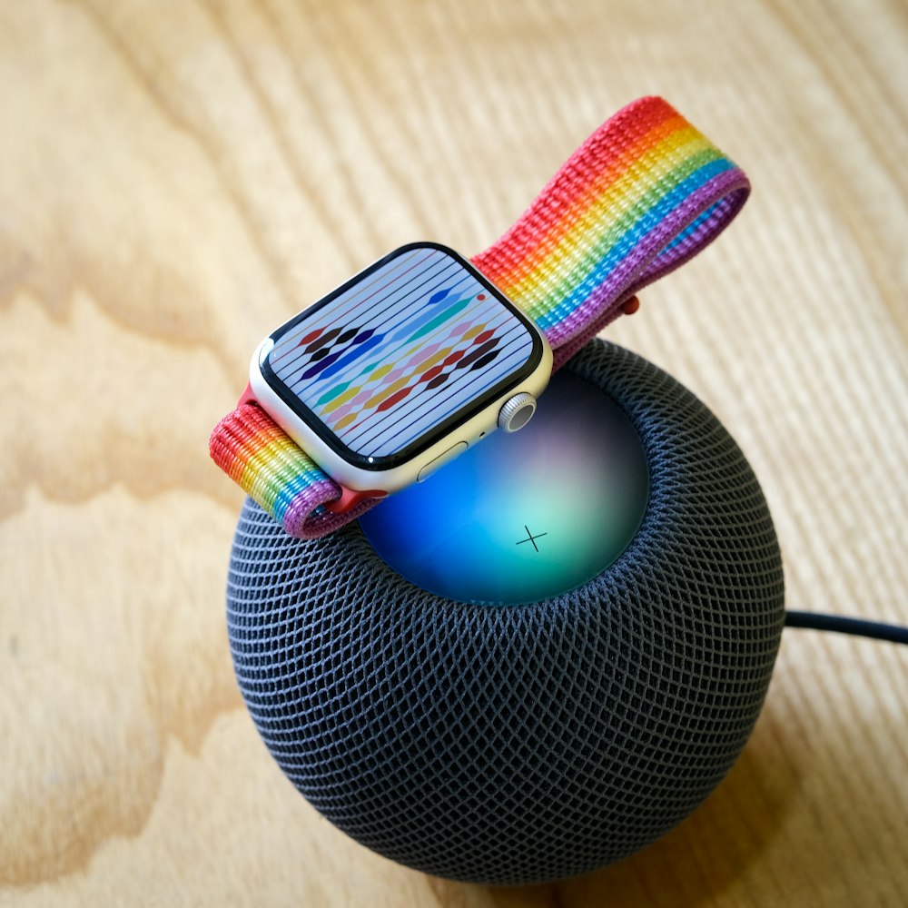 a colorful bracelet on a wooden surface