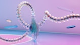 A futuristic abstract digital artwork features a central translucent spiral structure with iridescent segments, floating in a space with a soft pink and blue gradient background. Several thin, disk-like elements hover around the main spirals, adding to the sense of motion and depth.