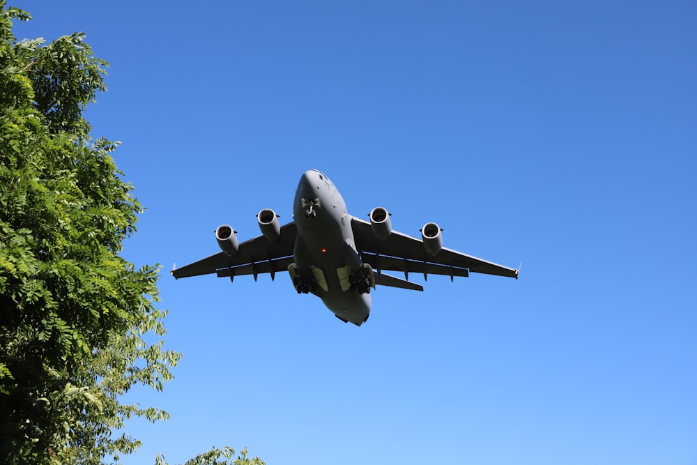 a large airplane flies through the air