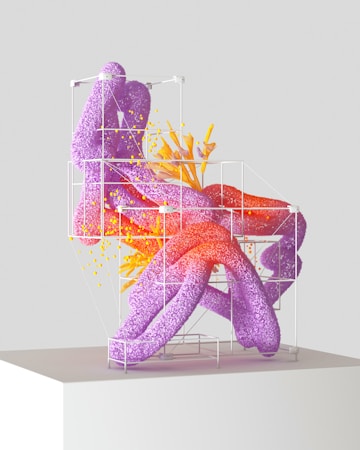 A modern, abstract sculpture composed of intertwined purple and red organic shapes within a white geometric frame. Yellow specks and tendrils add dynamic movement, giving the impression of growth or energy.