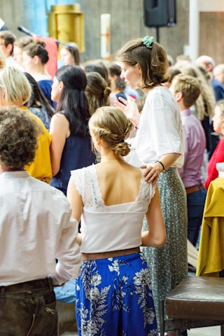 a group of people standing in a room