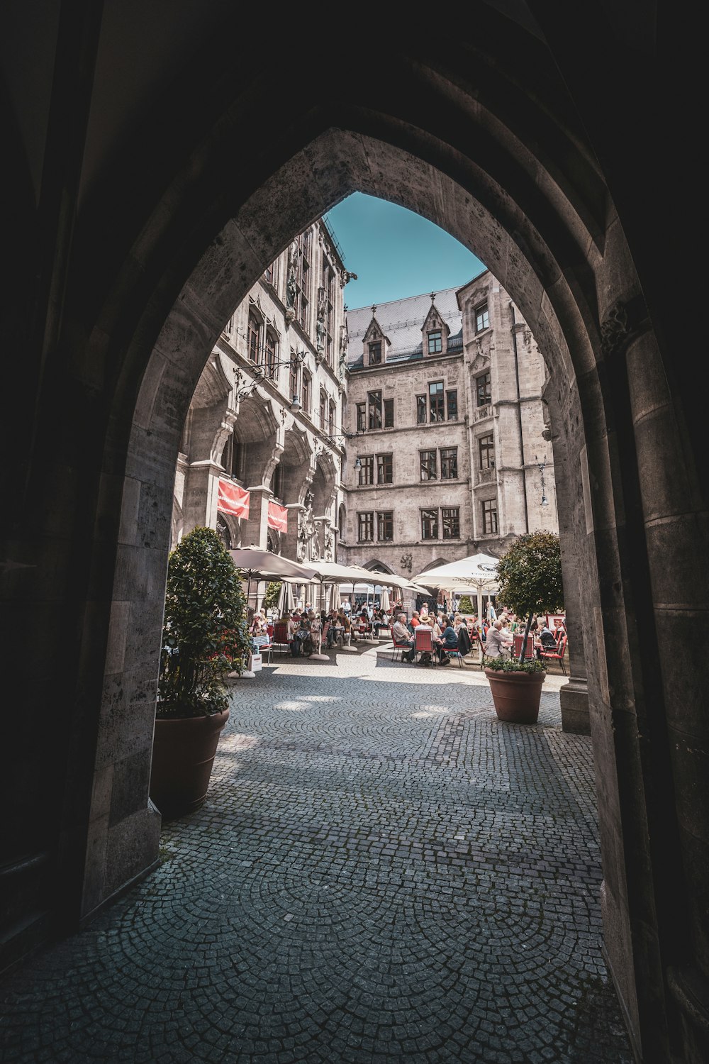 a stone walkway with buildings on either side of it