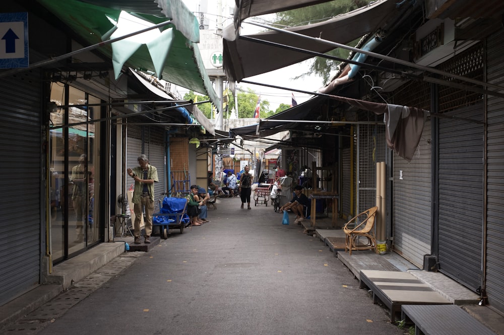 people walking in an alley