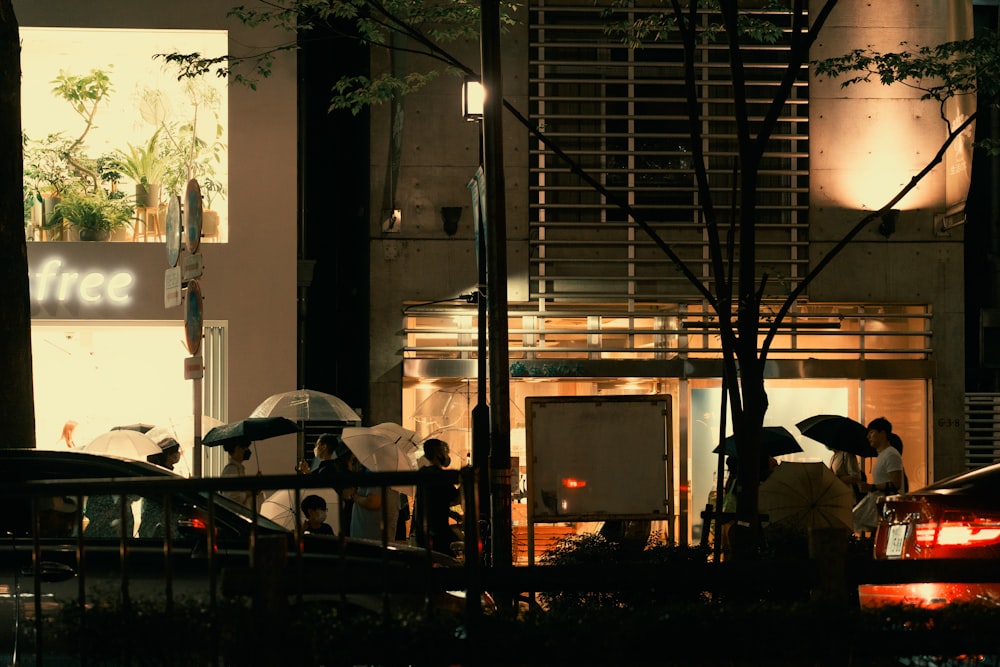 people with umbrellas on a street