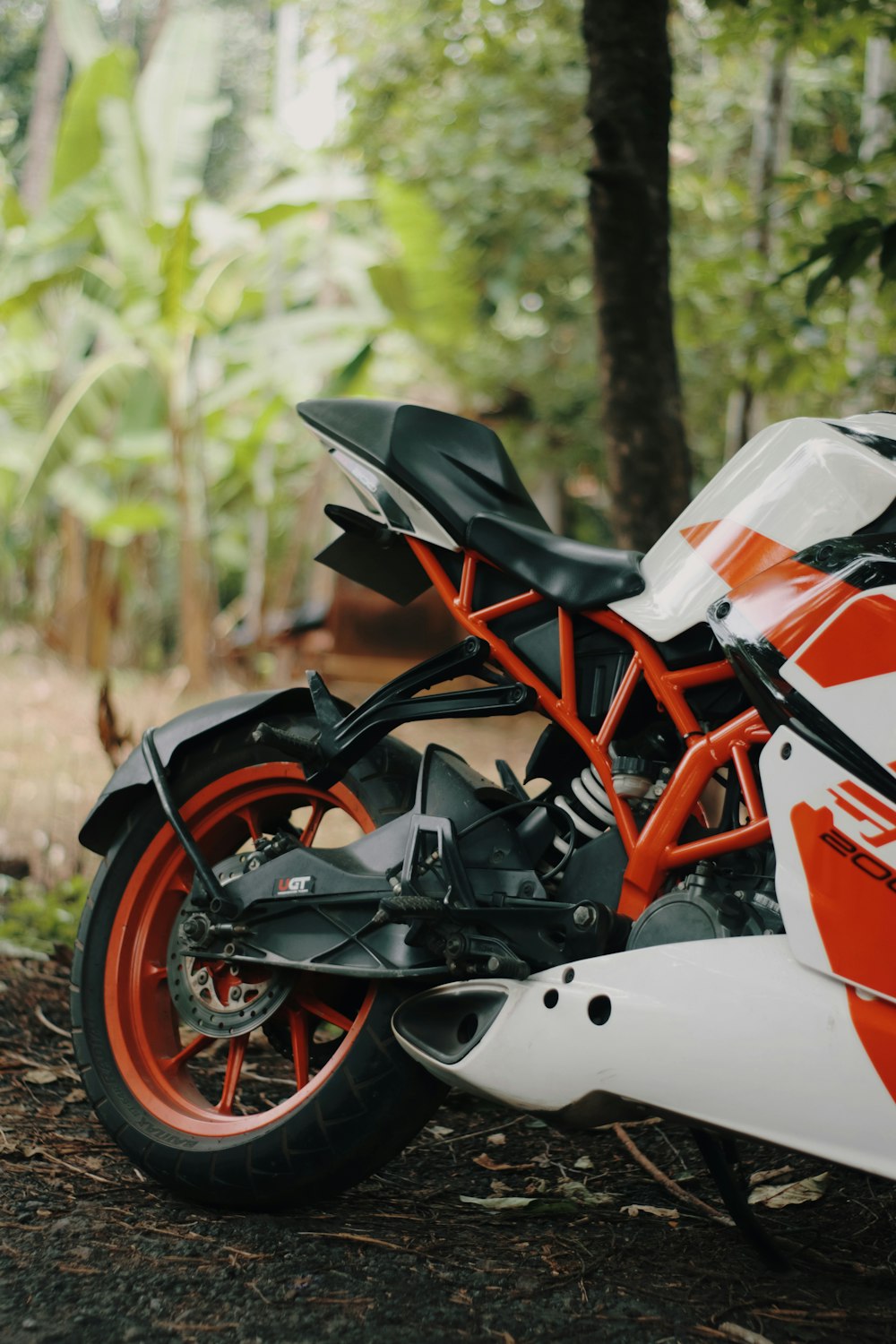 a motorcycle parked in the woods