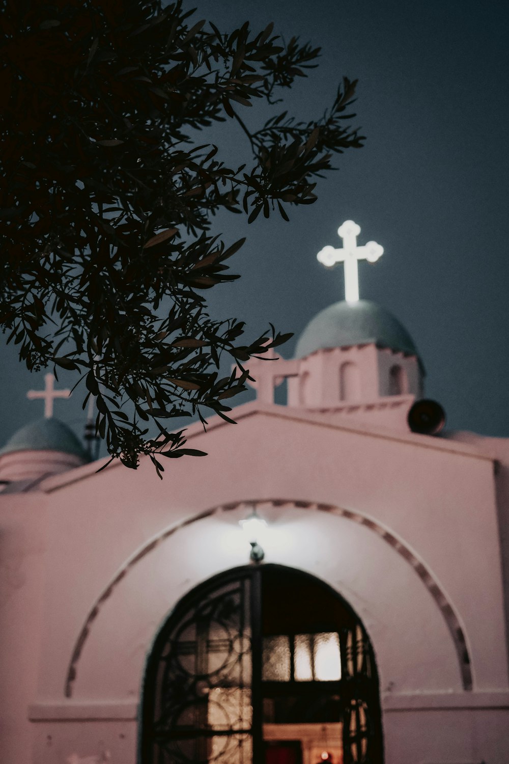 a white building with a cross on top