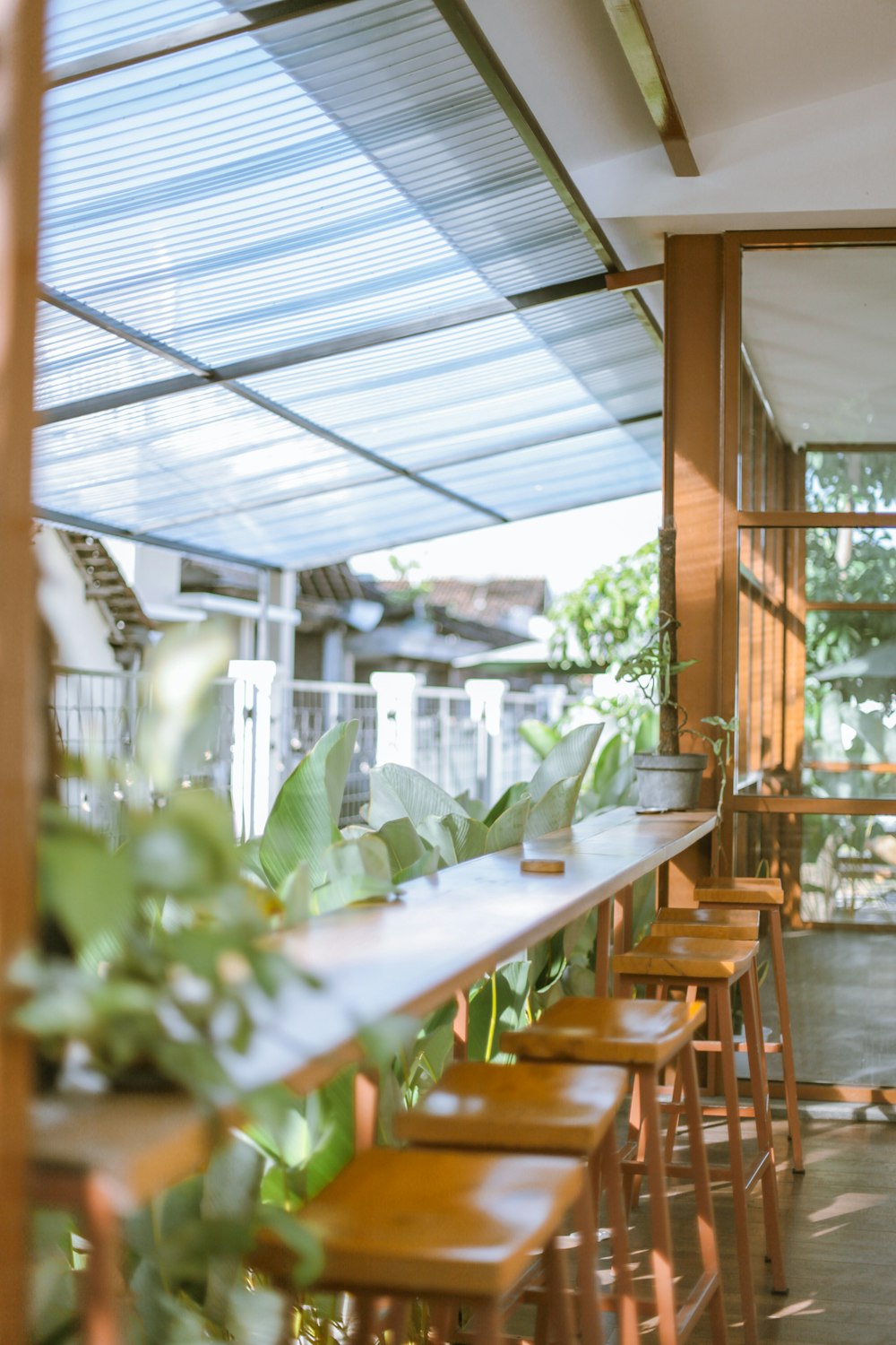 a room with tables and plants