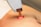 A close-up of Lycon wax being applied to skin.