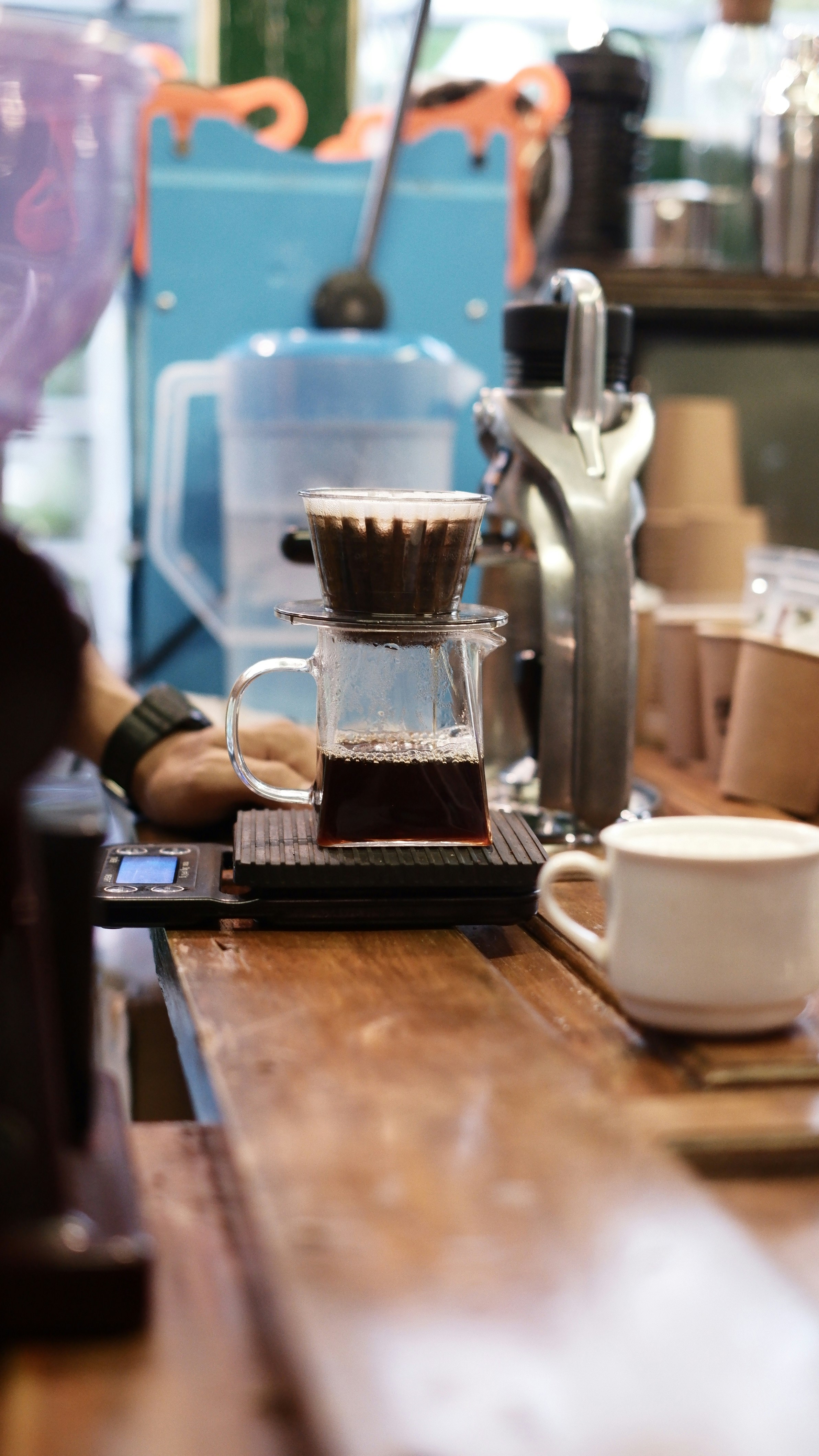 a coffee maker with a cup
