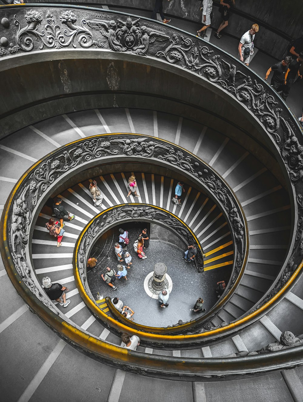 a group of people on a spiral staircase